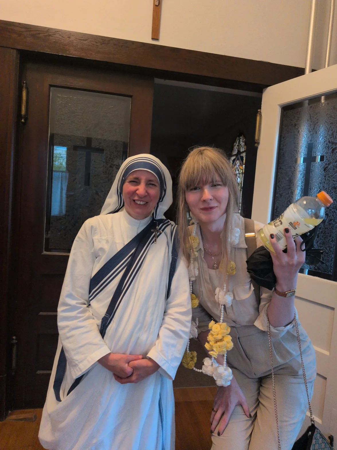 Sue with a Missionary of Charity sister at the church doorway